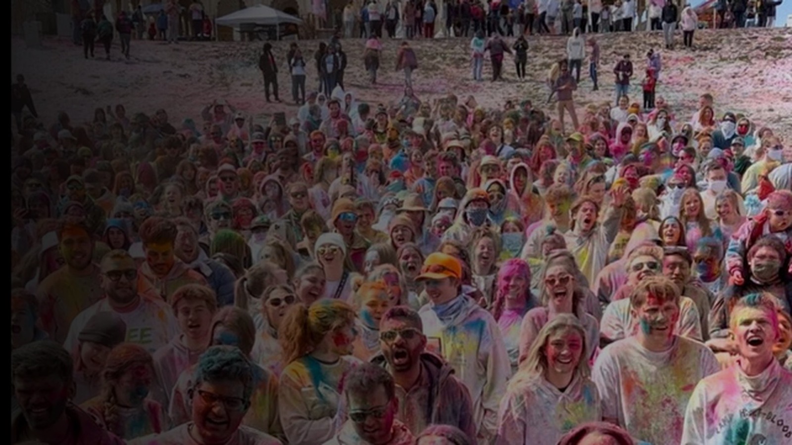 Festival crowd covered in colour at a Butter Thieves performance